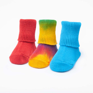 Red solid color, tie-dyed colorful, and bright blue solid color organic cotton baby anklet socks. Pack of three.