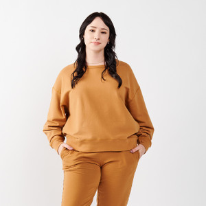 Model wearing Fleece Crew in Tawny color
