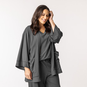 Front view of model wearing organic cotton kimono in pepper.