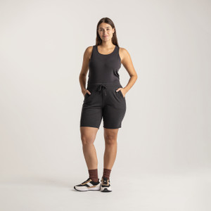 Full body view of model wearing sweat short in pepper.