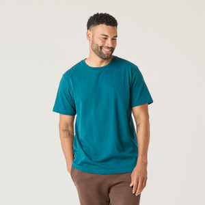 Front view of model wearing 100% Regenerative Organic Certified® Cotton - Classic Crew Neck Tee in teal.