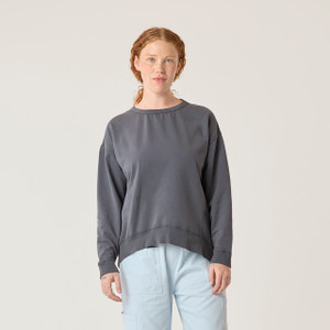 Front view of model wearing reversible fleece crew in infinity blue.