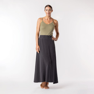Full body front view of model wearing organic cotton maxi skirt in pepper.