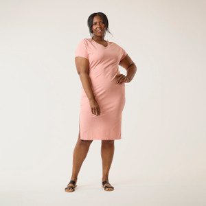 Front full body view of model wearing organic cotton kaftan dress in blush.