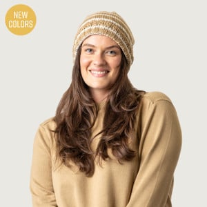 Close up of model wearing organic cotton chunky beanie in color khaki stripe