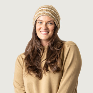 Close up of model wearing organic cotton chunky beanie in color khaki stripe