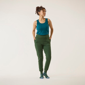 Full body front view of model wearing organic cotton fleece jogger in color pine.