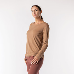 Side view of model wearing organic cotton layering tee in color turmeric