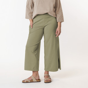Close up view of model wearing organic cotton gaucho pant in color bay.