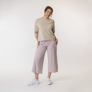 Full body view of model wearing organic cotton gaucho pant in color lavender.