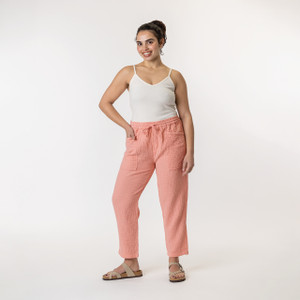 Full body front view of model wearing organic cotton harem pant in color blush.