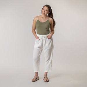 Full body front view of model wearing organic cotton harem pant in color salt.