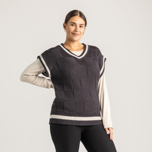 Front view of model wearing 100% Regenerative Organic Certified® Cotton sweater vest in color pepper.