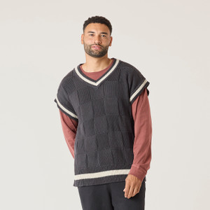Front view of model wearing 100% Regenerative Organic Certified® Cotton sweater vest in color pepper.