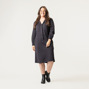 Full body front view of model wearing organic cotton workwear dress in color pepper.