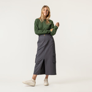 Front view of model wearing 100% organic cotton surplus skirt in color infinity blue.