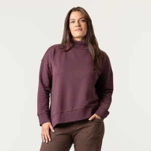 Front view of model wearing 100% Regenerative Organic Certified® Cotton Funnel Neck Top in color plum.