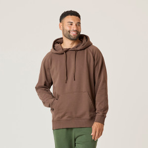 Front view of model wearing 100% Regenerative Organic Certified® Cotton Classic Hoodie in color chocolate.