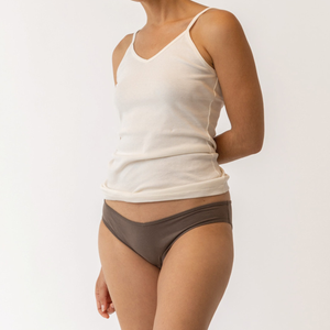 Close up front view of model wearing organic Cotton Women's Low-Rise Bikini in color sable.