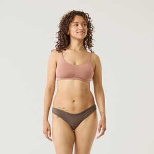 Full body front view of model wearing organic Cotton Women's Low-Rise Bikini in color sable.