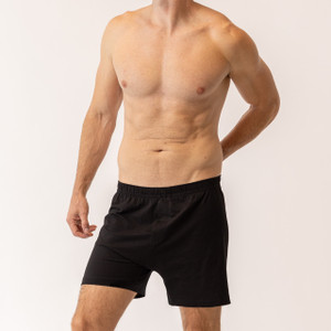 Close up front view of model wearing Organic Cotton Essentials - Men's Boxers in color black.