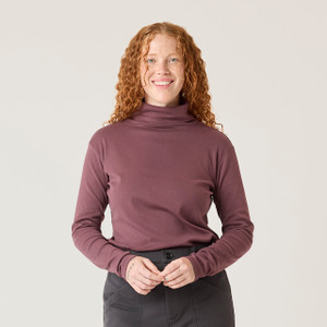Close up front view of model wearing organic cotton turtleneck in color plum.
