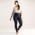 Full body front view of model wearing solid color infinity blue organic cotton fleece leggings.
