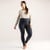 Full body front view of model wearing solid color infinity blue organic cotton fleece leggings.