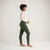 Full body side view of model wearing solid color pine organic cotton fleece leggings.