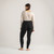 Model wearing black solid color organic cotton fleece leggings.