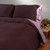 Aubergine checkered organic cotton and linen Duvet Cover shown on a bed.