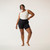 Full body front view of model wearing organic cotton blackout pocket leggings short.