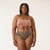 Close up front view of model wearing organic cotton essentials women's bikini 2 pak in color sable.
