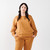 Model wearing Fleece Crew in Tawny color