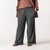 Front view of model wearing lounge pant in pepper.