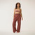 Full body front view of model wearing lounge pant in masala.