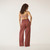 Full body back view of model wearing lounge pant in masala.