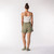 Full body back view of model wearing lounge short in bay.