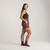 Full body side view of model wearing lounge short in masala.