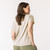 Back view of model wearing organic cotton slouch tee in pearl.