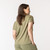 Back view of model wearing organic cotton slouch tee in bay.