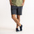 Front view of model wearing sweat short in infinity blue.