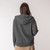 Back view of model wearing hooded cardigan in pepper.