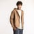 Front view of model wearing organic cotton hooded cardigan in turmeric.