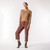 Full body view of model wearing cropped sweatpant in masala.