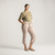 Full body view of model wearing cropped sweatpant in putty with hand on hip.