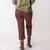 Back view of model wearing cropped sweatpant in masala.