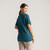 Back view of model wearing 100% Regenerative Organic Certified® Cotton - Classic Crew Neck Tee in teal.