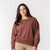 Front view of model wearing reversible crew in masala.