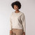 Front view of model wearing reversible fleece crew in pearl.